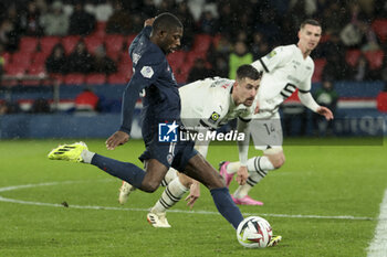 2024-02-25 - Ousmane Dembele of PSG, Baptiste Santamaria of Rennes during the French championship Ligue 1 football match between Paris Saint-Germain and Stade Rennais (Rennes) on February 25, 2024 at Parc des Princes stadium in Paris, France - FOOTBALL - FRENCH CHAMP - PARIS SG V RENNES - FRENCH LIGUE 1 - SOCCER