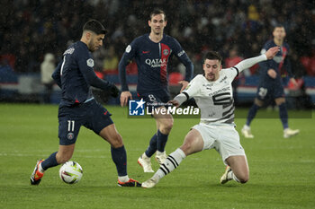 2024-02-25 - Marco Asensio of PSG, Baptiste Santamaria of Rennes, center Fabian Ruiz Pena of PSG during the French championship Ligue 1 football match between Paris Saint-Germain and Stade Rennais (Rennes) on February 25, 2024 at Parc des Princes stadium in Paris, France - FOOTBALL - FRENCH CHAMP - PARIS SG V RENNES - FRENCH LIGUE 1 - SOCCER