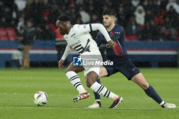 2024-02-25 - Arnaud Kalimuendo of Rennes, Lucas Beraldo of PSG during the French championship Ligue 1 football match between Paris Saint-Germain and Stade Rennais (Rennes) on February 25, 2024 at Parc des Princes stadium in Paris, France - FOOTBALL - FRENCH CHAMP - PARIS SG V RENNES - FRENCH LIGUE 1 - SOCCER