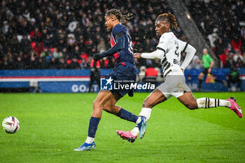 2024-02-25 - Bradley BARCOLA of PSG and Christopher WOOH of Rennes during the French championship Ligue 1 football match between Paris Saint-Germain and Stade Rennais (Rennes) on February 25, 2024 at Parc des Princes stadium in Paris, France - FOOTBALL - FRENCH CHAMP - PARIS SG V RENNES - FRENCH LIGUE 1 - SOCCER