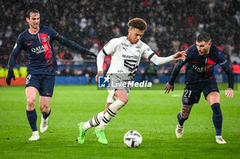 2024-02-25 - Fabian RUIZ of PSG, Desire DOUE of Rennes and Lucas HERNANDEZ of PSG during the French championship Ligue 1 football match between Paris Saint-Germain and Stade Rennais (Rennes) on February 25, 2024 at Parc des Princes stadium in Paris, France - FOOTBALL - FRENCH CHAMP - PARIS SG V RENNES - FRENCH LIGUE 1 - SOCCER
