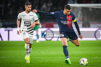 2024-02-25 - Ludovic BLAS of Rennes and Kylian MBAPPE of PSG during the French championship Ligue 1 football match between Paris Saint-Germain and Stade Rennais (Rennes) on February 25, 2024 at Parc des Princes stadium in Paris, France - FOOTBALL - FRENCH CHAMP - PARIS SG V RENNES - FRENCH LIGUE 1 - SOCCER