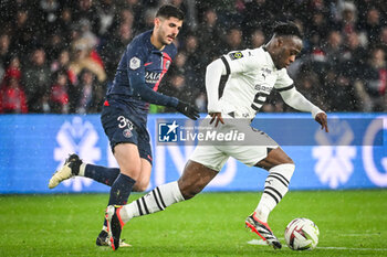 2024-02-25 - Lucas BERALDO of PSG and Arnaud KALIMUENDO of Rennes during the French championship Ligue 1 football match between Paris Saint-Germain and Stade Rennais (Rennes) on February 25, 2024 at Parc des Princes stadium in Paris, France - FOOTBALL - FRENCH CHAMP - PARIS SG V RENNES - FRENCH LIGUE 1 - SOCCER