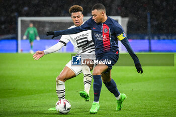 2024-02-25 - Desire DOUE of Rennes and Kylian MBAPPE of PSG during the French championship Ligue 1 football match between Paris Saint-Germain and Stade Rennais (Rennes) on February 25, 2024 at Parc des Princes stadium in Paris, France - FOOTBALL - FRENCH CHAMP - PARIS SG V RENNES - FRENCH LIGUE 1 - SOCCER