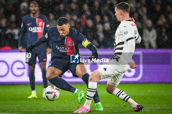 2024-02-25 - Kylian MBAPPE of PSG and Benjamin BOURIGEAUD of Rennes during the French championship Ligue 1 football match between Paris Saint-Germain and Stade Rennais (Rennes) on February 25, 2024 at Parc des Princes stadium in Paris, France - FOOTBALL - FRENCH CHAMP - PARIS SG V RENNES - FRENCH LIGUE 1 - SOCCER