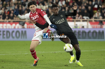 2024-03-01 - Takumi Minamino of Monaco, Nuno Mendes of PSG during the French championship Ligue 1 football match between AS Monaco (ASM) and Paris Saint-Germain (PSG) on March 1, 2024 at Stade Louis II in Monaco - FOOTBALL - FRENCH CHAMP - MONACO V PARIS SG - FRENCH LIGUE 1 - SOCCER