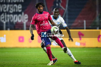 2024-03-02 - Muhammed CHAM of Clermont and Pape GUEYE of Marseille during the French championship Ligue 1 football match between Clermont Foor 63 and Olympique de Marseille on March 2, 2024 at Gabriel Montpied stadium in Clermont-Ferrand, France - FOOTBALL - FRENCH CHAMP - CLERMONT V MARSEILLE - FRENCH LIGUE 1 - SOCCER