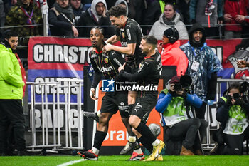 2024-03-03 - Elye WAHI of Lens celebrate his goal with Neil EL AYNAOUI of Lens and Przemyslaw Adam FRANKOWSKI of Lens during the French championship Ligue 1 football match between Olympique Lyonnais and RC Lens on March 3, 2024 at Groupama stadium in Decines-Charpieu near Lyon, France - FOOTBALL - FRENCH CHAMP - LYON V LENS - FRENCH LIGUE 1 - SOCCER