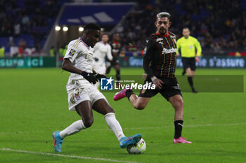 2024-03-03 - Ernest NUAMAH of Lyon and Facundo MEDINA of Lens during the French championship Ligue 1 football match between Olympique Lyonnais and RC Lens on March 3, 2024 at Groupama stadium in Décines-Charpieu near Lyon, France - FOOTBALL - FRENCH CHAMP - LYON V LENS - FRENCH LIGUE 1 - SOCCER