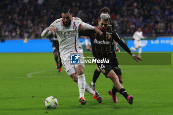 2024-03-03 - Rayan CHERKI of Lyon and Facundo MEDINA of Lens during the French championship Ligue 1 football match between Olympique Lyonnais and RC Lens on March 3, 2024 at Groupama stadium in Décines-Charpieu near Lyon, France - FOOTBALL - FRENCH CHAMP - LYON V LENS - FRENCH LIGUE 1 - SOCCER