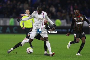 2024-03-03 - Mama BALDE of Lyon and Neil EL AYNAOUI of Lens and Salis ABDUL SAMED of Lens during the French championship Ligue 1 football match between Olympique Lyonnais and RC Lens on March 3, 2024 at Groupama stadium in Décines-Charpieu near Lyon, France - FOOTBALL - FRENCH CHAMP - LYON V LENS - FRENCH LIGUE 1 - SOCCER