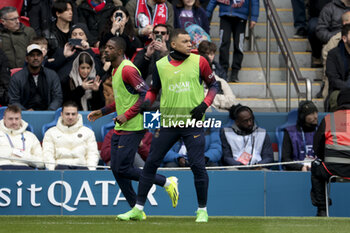 2024-03-10 - Ousmane Dembele, Kylian Mbappe of PSG warm up during the French championship Ligue 1 football match between Paris Saint-Germain and Stade de Reims on March 10, 2024 at Parc des Princes stadium in Paris, France - FOOTBALL - FRENCH CHAMP - PARIS SG V REIMS - FRENCH LIGUE 1 - SOCCER