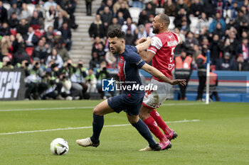 2024-03-10 - Goncalo Ramos of PSG, Yunis Abdelhamid of Reims during the French championship Ligue 1 football match between Paris Saint-Germain and Stade de Reims on March 10, 2024 at Parc des Princes stadium in Paris, France - FOOTBALL - FRENCH CHAMP - PARIS SG V REIMS - FRENCH LIGUE 1 - SOCCER