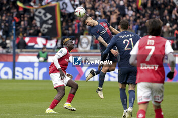 2024-03-10 - Lucas Beraldo of PSG, left Oumar Diakite of Reims during the French championship Ligue 1 football match between Paris Saint-Germain and Stade de Reims on March 10, 2024 at Parc des Princes stadium in Paris, France - FOOTBALL - FRENCH CHAMP - PARIS SG V REIMS - FRENCH LIGUE 1 - SOCCER