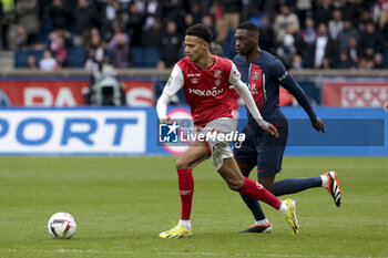 2024-03-10 - Amir Richardson of Reims, Randal Kolo Muani of PSG during the French championship Ligue 1 football match between Paris Saint-Germain and Stade de Reims on March 10, 2024 at Parc des Princes stadium in Paris, France - FOOTBALL - FRENCH CHAMP - PARIS SG V REIMS - FRENCH LIGUE 1 - SOCCER