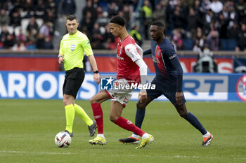 2024-03-10 - Amir Richardson of Reims, Randal Kolo Muani of PSG during the French championship Ligue 1 football match between Paris Saint-Germain and Stade de Reims on March 10, 2024 at Parc des Princes stadium in Paris, France - FOOTBALL - FRENCH CHAMP - PARIS SG V REIMS - FRENCH LIGUE 1 - SOCCER