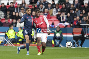 2024-03-10 - Bradley Barcola of PSG, Emmanuel Agbadou of Reims during the French championship Ligue 1 football match between Paris Saint-Germain and Stade de Reims on March 10, 2024 at Parc des Princes stadium in Paris, France - FOOTBALL - FRENCH CHAMP - PARIS SG V REIMS - FRENCH LIGUE 1 - SOCCER