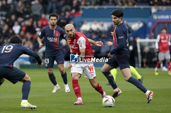 2024-03-10 - Teddy Teuma of Reims, Carlos Soler of PSG during the French championship Ligue 1 football match between Paris Saint-Germain and Stade de Reims on March 10, 2024 at Parc des Princes stadium in Paris, France - FOOTBALL - FRENCH CHAMP - PARIS SG V REIMS - FRENCH LIGUE 1 - SOCCER