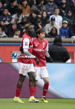 2024-03-10 - Oumar Diakite of Reims celebrates his goal with Junya Ito of Reims during the French championship Ligue 1 football match between Paris Saint-Germain and Stade de Reims on March 10, 2024 at Parc des Princes stadium in Paris, France - FOOTBALL - FRENCH CHAMP - PARIS SG V REIMS - FRENCH LIGUE 1 - SOCCER