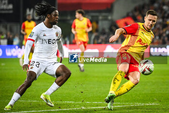 2024-03-16 - Jordan LOTOMBA of Nice and Przemyslaw Adam FRANKOWSKI of Lens during the French championship Ligue 1 football match between RC Lens and OGC Nice on March 16, 2024 at Bollaert-Delelis stadium in Lens, France - FOOTBALL - FRENCH CHAMP - LENS V NICE - FRENCH LIGUE 1 - SOCCER