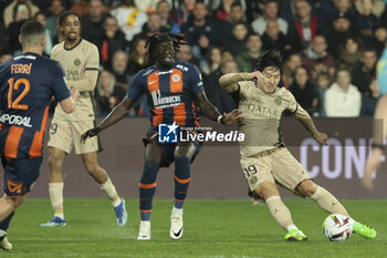 2024-03-17 - Lee Kang-in of PSG, left Tanguy Coulibaly of Montpellier during the French championship Ligue 1 football match between Montpellier HSC (MHSC) and Paris Saint-Germain (PSG) on March 17, 2024 at La Mosson stadium in Montpellier, France - FOOTBALL - FRENCH CHAMP - MONTPELLIER V PARIS SG - FRENCH LIGUE 1 - SOCCER