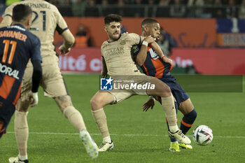 2024-03-17 - Lucas Beraldo of PSG, Arnaud Nordin of Montpellier during the French championship Ligue 1 football match between Montpellier HSC (MHSC) and Paris Saint-Germain (PSG) on March 17, 2024 at La Mosson stadium in Montpellier, France - FOOTBALL - FRENCH CHAMP - MONTPELLIER V PARIS SG - FRENCH LIGUE 1 - SOCCER