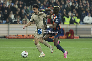 2024-03-17 - Warren Zaire-Emery of PSG, Falaye Sacko of Montpellier during the French championship Ligue 1 football match between Montpellier HSC (MHSC) and Paris Saint-Germain (PSG) on March 17, 2024 at La Mosson stadium in Montpellier, France - FOOTBALL - FRENCH CHAMP - MONTPELLIER V PARIS SG - FRENCH LIGUE 1 - SOCCER