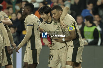 2024-03-17 - Lee Kang-in of PSG celebrates his goal with Kylian Mbappe of PSG during the French championship Ligue 1 football match between Montpellier HSC (MHSC) and Paris Saint-Germain (PSG) on March 17, 2024 at La Mosson stadium in Montpellier, France - FOOTBALL - FRENCH CHAMP - MONTPELLIER V PARIS SG - FRENCH LIGUE 1 - SOCCER
