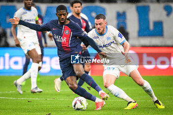 2024-03-31 - Ousmane DEMBELE of PSG and Jordan VERETOUT of Marseille during the French championship Ligue 1 football match between Olympique de Marseille and Paris Saint-Germain on March 31, 2024 at Orange Velodrome stadium in Marseille, France - FOOTBALL - FRENCH CHAMP - MARSEILLE V PARIS SG - FRENCH LIGUE 1 - SOCCER