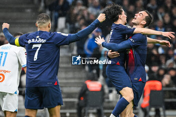 2024-03-31 - Vitor MACHADO FERREIRA (Vitinha) of PSG celebrate his goal with Fabian RUIZ of PSG and Kylian MBAPPE of PSG during the French championship Ligue 1 football match between Olympique de Marseille and Paris Saint-Germain on March 31, 2024 at Orange Velodrome stadium in Marseille, France - FOOTBALL - FRENCH CHAMP - MARSEILLE V PARIS SG - FRENCH LIGUE 1 - SOCCER