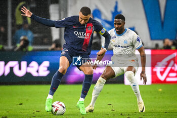 2024-03-31 - Kylian MBAPPE of PSG and Ulisses GARCIA of Marseille during the French championship Ligue 1 football match between Olympique de Marseille and Paris Saint-Germain on March 31, 2024 at Orange Velodrome stadium in Marseille, France - FOOTBALL - FRENCH CHAMP - MARSEILLE V PARIS SG - FRENCH LIGUE 1 - SOCCER