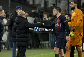 2024-03-31 - PSG manager Luis Campos salutes Manuel Ugarte, PSG goalkeeper Gianluigi Donnarumma following the French championship Ligue 1 football match between Olympique de Marseille (OM) and Paris Saint-Germain (PSG) on March 31, 2024 at Stade Velodrome in Marseille, France - FOOTBALL - FRENCH CHAMP - MARSEILLE V PARIS SG - FRENCH LIGUE 1 - SOCCER
