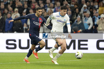 2024-03-31 - Leonardo Balerdi of Marseille, left Achraf Hakimi of PSG during the French championship Ligue 1 football match between Olympique de Marseille (OM) and Paris Saint-Germain (PSG) on March 31, 2024 at Stade Velodrome in Marseille, France - FOOTBALL - FRENCH CHAMP - MARSEILLE V PARIS SG - FRENCH LIGUE 1 - SOCCER