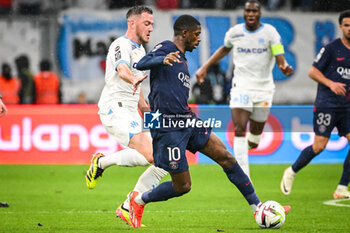 2024-03-31 - Jordan VERETOUT of Marseille and Ousmane DEMBELE of PSG during the French championship Ligue 1 football match between Olympique de Marseille and Paris Saint-Germain on March 31, 2024 at Orange Velodrome stadium in Marseille, France - FOOTBALL - FRENCH CHAMP - MARSEILLE V PARIS SG - FRENCH LIGUE 1 - SOCCER