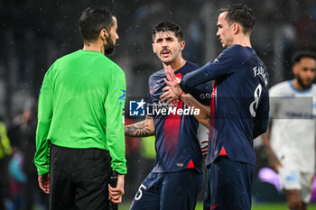 2024-03-31 - Lucas BERALDO of PSG and Fabian RUIZ of PSG during the French championship Ligue 1 football match between Olympique de Marseille and Paris Saint-Germain on March 31, 2024 at Orange Velodrome stadium in Marseille, France - FOOTBALL - FRENCH CHAMP - MARSEILLE V PARIS SG - FRENCH LIGUE 1 - SOCCER