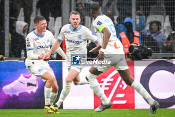 2024-03-31 - Jordan VERETOUT of Marseille celebrate his goal with Quentin MERLIN of Marseille and Geoffrey KONDOGBIA of Marseille during the French championship Ligue 1 football match between Olympique de Marseille and Paris Saint-Germain on March 31, 2024 at Orange Velodrome stadium in Marseille, France - FOOTBALL - FRENCH CHAMP - MARSEILLE V PARIS SG - FRENCH LIGUE 1 - SOCCER