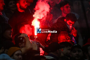 2024-03-31 - A supporter of Marseille uses a smoke bomb during the French championship Ligue 1 football match between Olympique de Marseille and Paris Saint-Germain on March 31, 2024 at Orange Velodrome stadium in Marseille, France - FOOTBALL - FRENCH CHAMP - MARSEILLE V PARIS SG - FRENCH LIGUE 1 - SOCCER