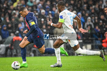 2024-03-31 - Kylian MBAPPE of PSG and Geoffrey KONDOGBIA of Marseille during the French championship Ligue 1 football match between Olympique de Marseille and Paris Saint-Germain on March 31, 2024 at Orange Velodrome stadium in Marseille, France - FOOTBALL - FRENCH CHAMP - MARSEILLE V PARIS SG - FRENCH LIGUE 1 - SOCCER