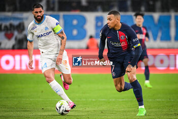 2024-03-31 - Samuel GIGOT of Marseille and Kylian MBAPPE of PSG during the French championship Ligue 1 football match between Olympique de Marseille and Paris Saint-Germain on March 31, 2024 at Orange Velodrome stadium in Marseille, France - FOOTBALL - FRENCH CHAMP - MARSEILLE V PARIS SG - FRENCH LIGUE 1 - SOCCER