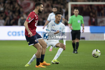 2024-04-05 - Nabil Bentaleb of Lille, Azzedine Ounahi of Marseille during the French championship Ligue 1 football match between Lille OSC (LOSC) and Olympique de Marseille (OM) on April 5, 2024 at Stade Pierre Mauroy in Villeneuve-d'Ascq near Lille, France - FOOTBALL - FRENCH CHAMP - LILLE V MARSEILLE - FRENCH LIGUE 1 - SOCCER