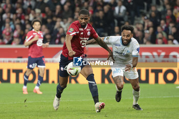 2024-04-05 - Alexsandro Ribeiro of Lille, Pierre-Emerick Aubameyang of Marseille during the French championship Ligue 1 football match between Lille OSC (LOSC) and Olympique de Marseille (OM) on April 5, 2024 at Stade Pierre Mauroy in Villeneuve-d'Ascq near Lille, France - FOOTBALL - FRENCH CHAMP - LILLE V MARSEILLE - FRENCH LIGUE 1 - SOCCER