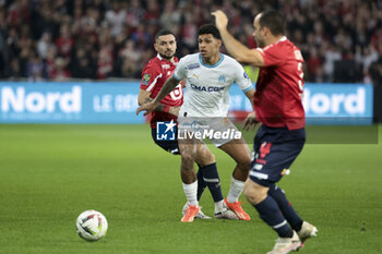 2024-04-05 - Luis Henrique Tomaz of Marseille, left Remy Cabella of Lille during the French championship Ligue 1 football match between Lille OSC (LOSC) and Olympique de Marseille (OM) on April 5, 2024 at Stade Pierre Mauroy in Villeneuve-d'Ascq near Lille, France - FOOTBALL - FRENCH CHAMP - LILLE V MARSEILLE - FRENCH LIGUE 1 - SOCCER