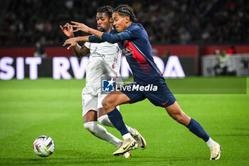 2024-04-06 - Muhammed CHAM of Clermont and Senny MAYULU of PSG during the French championship Ligue 1 football match between Paris Saint-Germain and Clermont Foot 63 on April 6, 2024 at Parc des Princes stadium in Paris, France - FOOTBALL - FRENCH CHAMP - PARIS SG V CLERMONT - FRENCH LIGUE 1 - SOCCER