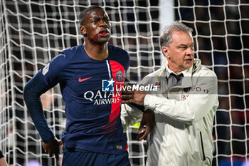 2024-04-06 - Nordi MUKIELE of PSG looks injured and Patrick FLAMANT of PSG during the French championship Ligue 1 football match between Paris Saint-Germain and Clermont Foot 63 on April 6, 2024 at Parc des Princes stadium in Paris, France - FOOTBALL - FRENCH CHAMP - PARIS SG V CLERMONT - FRENCH LIGUE 1 - SOCCER