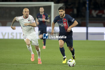 2024-04-06 - Marco Asensio of PSG, left Johan Gastien of Clermont during the French championship Ligue 1 football match between Paris Saint-Germain and Clermont Foot 63 on April 6, 2024 at Parc des Princes stadium in Paris, France - FOOTBALL - FRENCH CHAMP - PARIS SG V CLERMONT - FRENCH LIGUE 1 - SOCCER