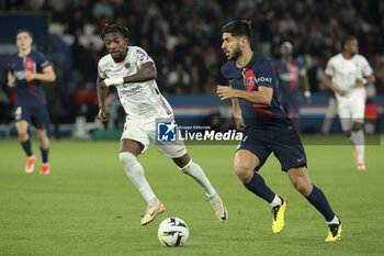 2024-04-06 - Marco Asensio of PSG, left Muhammed Cham Saracevic of Clermont during the French championship Ligue 1 football match between Paris Saint-Germain and Clermont Foot 63 on April 6, 2024 at Parc des Princes stadium in Paris, France - FOOTBALL - FRENCH CHAMP - PARIS SG V CLERMONT - FRENCH LIGUE 1 - SOCCER