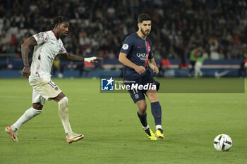 2024-04-06 - Marco Asensio of PSG, left Muhammed Cham Saracevic of Clermont during the French championship Ligue 1 football match between Paris Saint-Germain and Clermont Foot 63 on April 6, 2024 at Parc des Princes stadium in Paris, France - FOOTBALL - FRENCH CHAMP - PARIS SG V CLERMONT - FRENCH LIGUE 1 - SOCCER