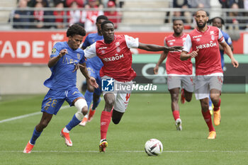 2024-04-07 - Hicham Boudaoui of Nice, Joseph Okumu of Reims during the French championship Ligue 1 football match between Stade de Reims and OGC Nice (OGCN) on April 7, 2024 at Stade Auguste Delaune in Reims, France - FOOTBALL - FRENCH CHAMP - REIMS V NICE - FRENCH LIGUE 1 - SOCCER