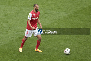 2024-04-07 - Yunis Abdelhamid of Reims during the French championship Ligue 1 football match between Stade de Reims and OGC Nice (OGCN) on April 7, 2024 at Stade Auguste Delaune in Reims, France - FOOTBALL - FRENCH CHAMP - REIMS V NICE - FRENCH LIGUE 1 - SOCCER