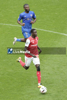 2024-04-07 - Joseph Okumu of Reims, above Terem Moffi of Nice during the French championship Ligue 1 football match between Stade de Reims and OGC Nice (OGCN) on April 7, 2024 at Stade Auguste Delaune in Reims, France - FOOTBALL - FRENCH CHAMP - REIMS V NICE - FRENCH LIGUE 1 - SOCCER